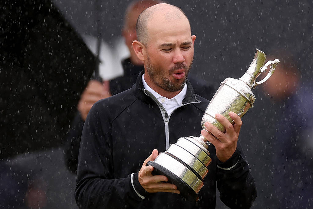 Brian Harman admires the Claret Jug